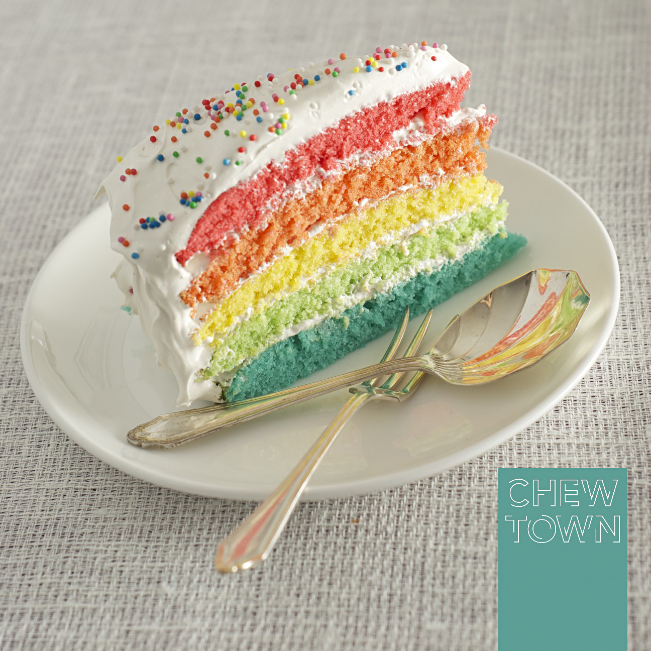 Rainbow Cake with Meringue Frosting Recipe | Chew Town Food Blog